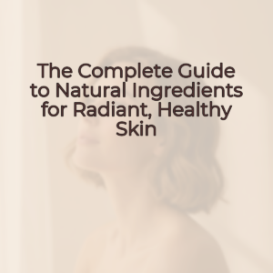 A woman with short hair and natural glowing skin in a relaxed pose, with a genuine, confident smile.