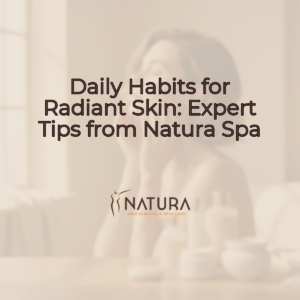 A serene, warmly lit background, perfect for a spa. It features soft, natural tones of beige and brown, with a hint of an elegant, minimalist form in the distance.