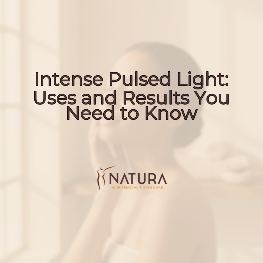 A woman confidently smiling, touching her face, with glowing, natural skin. The background is softly blurred with warm, natural tones.