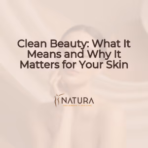 A woman with glowing skin, showcasing a clean beauty routine against a soft, warm background.