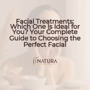 A woman with a diverse skin tone and a natural, relaxed pose is featured in soft, diffused lighting. She's touching her face with a genuine, confident smile, embodying a luxurious and trustworthy spa-like mood.