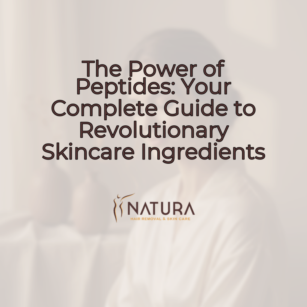 A woman with radiant, clear skin smiling gently, her fingers delicately touching her cheek against a soft, blurred backdrop of warm neutrals.