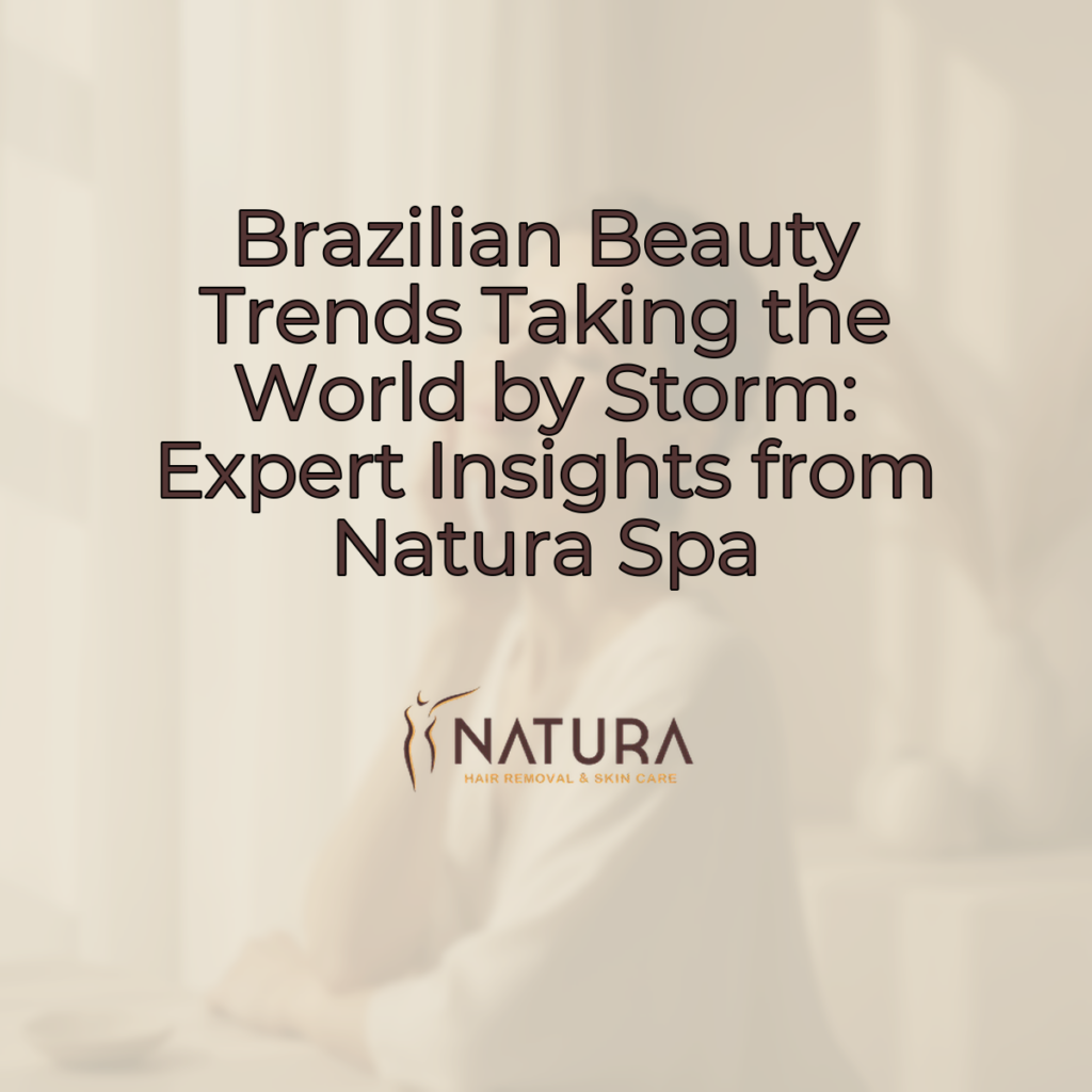 A woman with glowing skin touching her face, in a relaxed pose with a genuine smile. Soft, diffused lighting enhances the warm beige, cream, and soft brown palette. The background is slightly blurred.