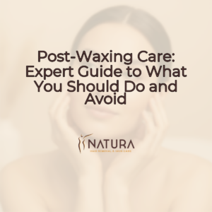 A woman with glowing skin touching her face, set against a soft, blurred background in warm beige and cream tones.