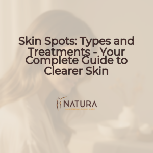 A woman with glowing skin, serene half-profile, in a soft, diffused light, touching her face. The background is softly blurred.