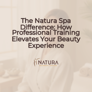 A woman with radiant skin, softly lit, in a natural spa setting. She has a serene expression and a gentle smile, with her hand lightly touching her face. The background is blurred, focusing on her tranquil presence, evoking a luxurious and natural skincare experience. The overall tone is warm and inviting, using a palette of soft beiges, creams, and browns. This image is professional and designed to promote a sense of wellness and natural beauty.