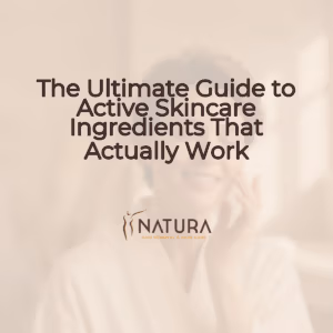 A luxurious feeling image in soft warm tones of beige, cream, and brown, with a woman applying skincare.
