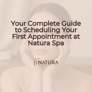 A serene, warm beige and soft brown background image featuring a woman with glowing skin and a contemplative gaze, suitable for a spa promotion.