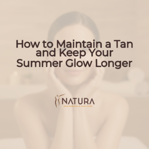 A woman with glowing skin, relaxed in a spa pose, touching her face with a genuine confident smile. Soft diffused lighting illuminates the scene, with a blurred natural background.