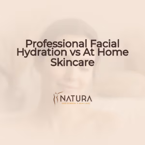 A serene female model with natural glowing skin, relaxed, eyes closed, touching her face, exuding a confident smile. The scene is bathed in soft diffused lighting with a blurred background, embodying a luxurious and spa-like natural aesthetic.