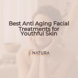 A woman with glowing skin touching her face, in a spa-like setting.