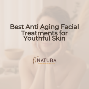 A woman with glowing skin touching her face, in a spa-like setting.