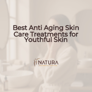 A serene woman with glowing skin touching her face, in a spa-like setting.