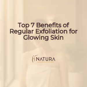 A woman in a towel wrap in a spa setting with glowing skin, smiling confidently, soft diffused lighting.